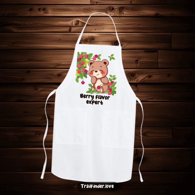 Funny apron showing a playful bear character joyfully sniffing a berry bush, perfect for kitchen use or themed events.