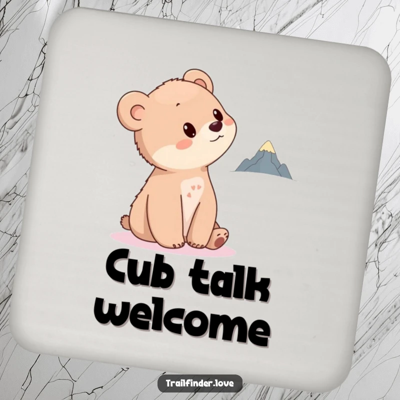 Funny Bear Cub Drink Coaster featuring a curious cub tilting its head towards a distant, tiny mountain, protecting surfaces with charm and dreams.