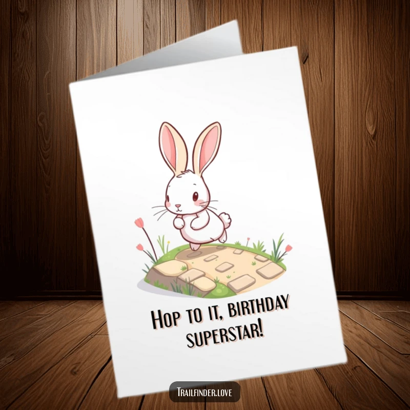 Funny Free Printable Birthday Card: A happy rabbit with huge ears leaps up a tiny path, spreading cheer. A downloadable delight!