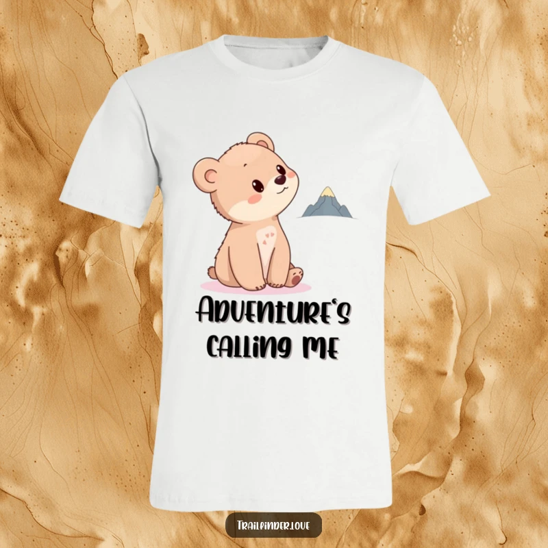 Funny Bear Cub T-Shirt depicting a cute cub tilting its head towards a distant, tiny mountain, symbolizing curiosity and the call of adventure.