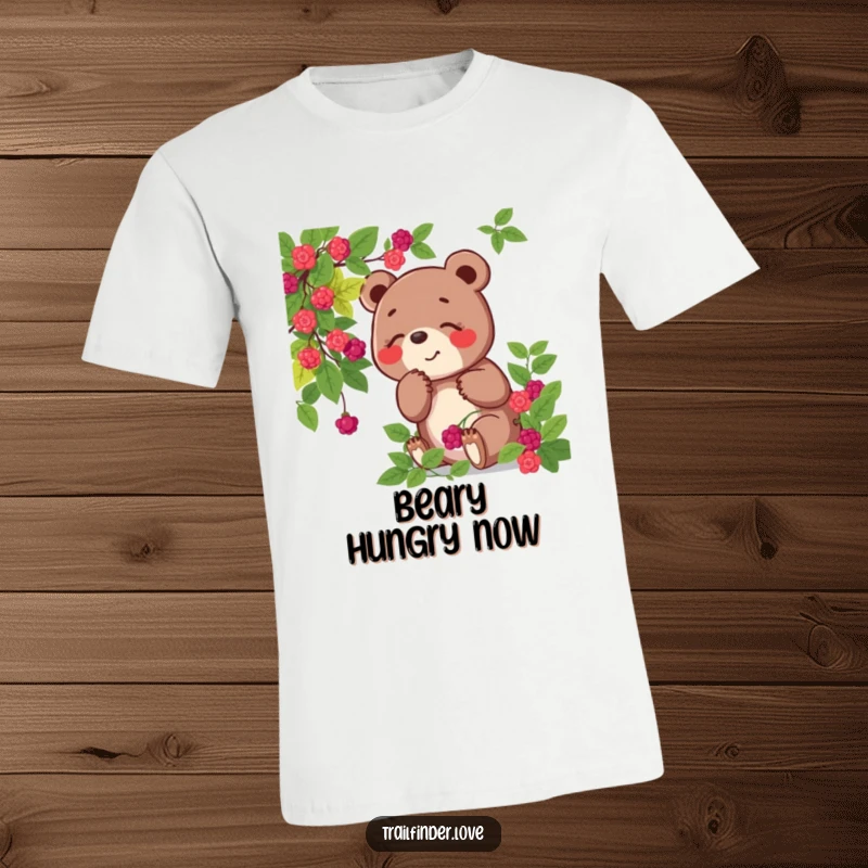 Funny t-shirt depicting a playful bear character joyfully sniffing a wild berry bush, showcasing a love for nature's sweet bounty.