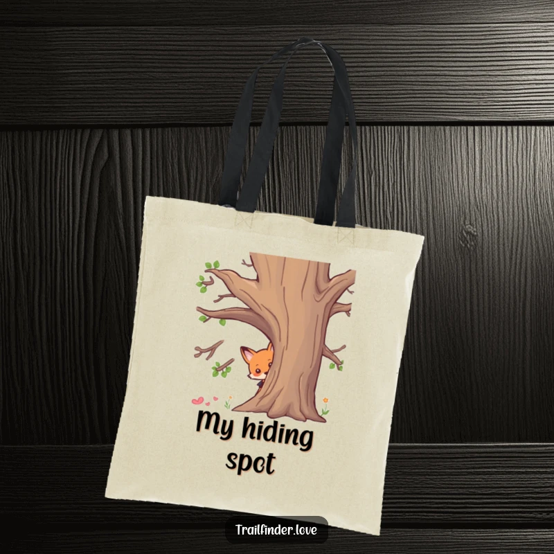 Funny tote bag featuring a curious fox character peeking from behind a tree, showcasing intrigue and a playful spirit, great funny gift.